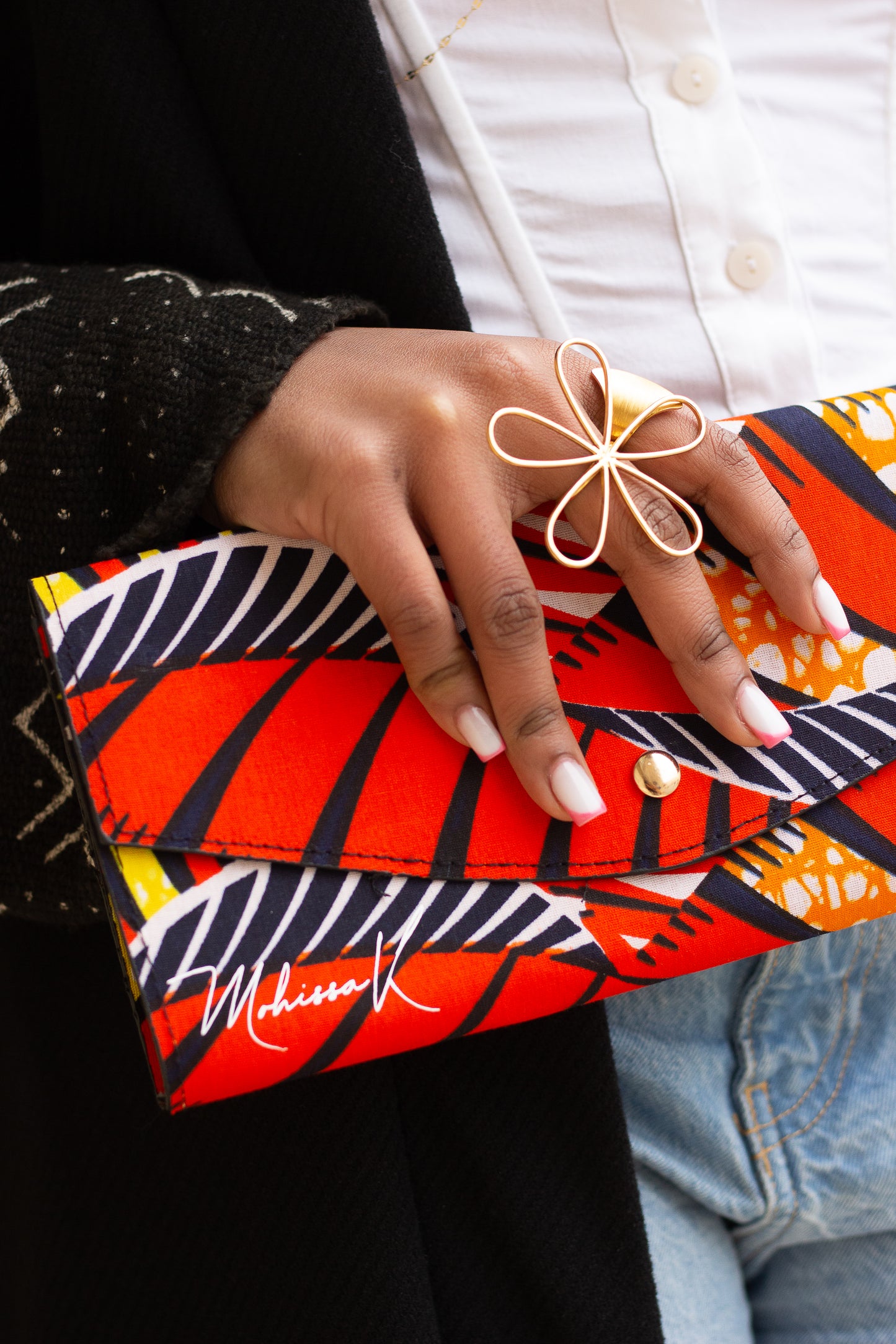 Pochette en wax Elégante et Moderne avec une lance en chaine